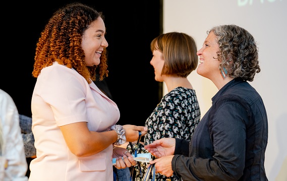 New students are welcoming by Dornsife chairs at a Pinning Ceremony held each September